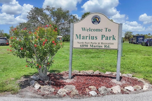 6821 Marius Rd, North Port, FL 34287 - community / neighborhood sign featuring a lawn