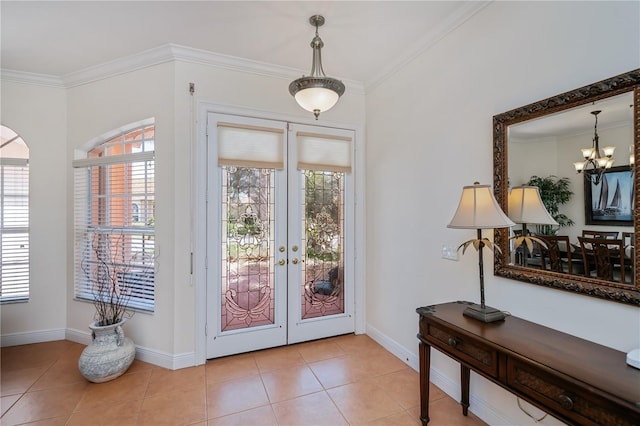 4308 Via Del Santi, Venice, FL 34293 - entrance foyer with plenty of natural light, ornamental molding, a chandelier, light tile patterned floors, and french doors