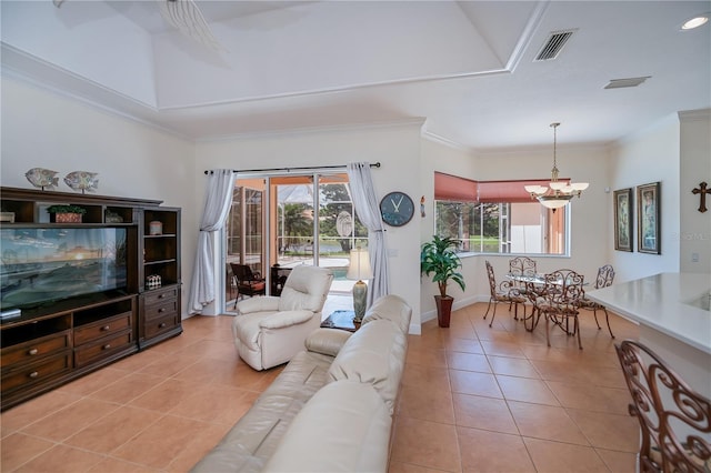 4308 Via Del Santi, Venice, FL 34293 - living room with light tile patterned flooring, ornamental molding, and a chandelier