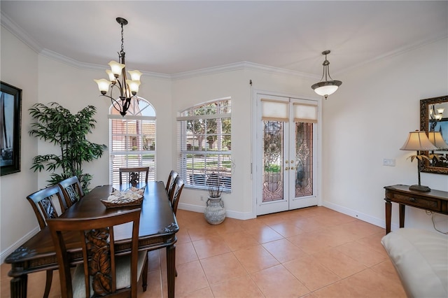 4308 Via Del Santi, Venice, FL 34293 - dining room featuring a chandelier, ornamental molding, french doors, and light tile patterned flooring