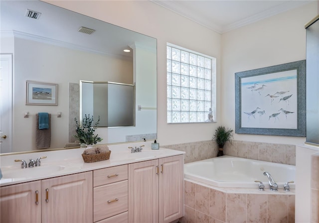 4308 Via Del Santi, Venice, FL 34293 - bathroom featuring a bath, double vanity, and crown molding