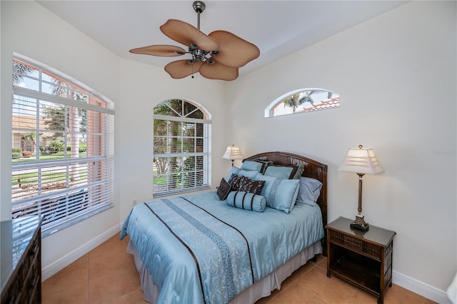 4308 Via Del Santi, Venice, FL 34293 - bedroom featuring light tile patterned flooring, multiple windows, and ceiling fan