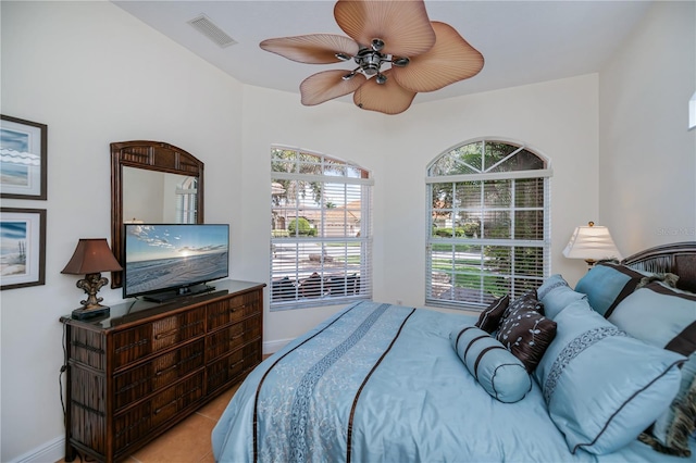 4308 Via Del Santi, Venice, FL 34293 - bedroom with light tile patterned floors and ceiling fan