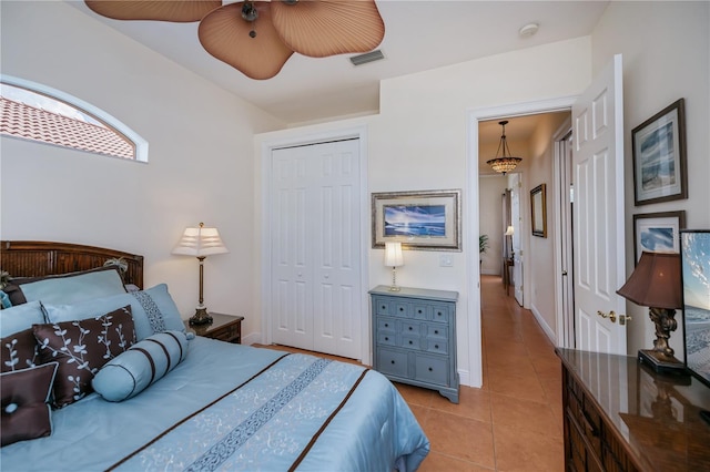 4308 Via Del Santi, Venice, FL 34293 - bedroom with a closet, light tile patterned floors, and a ceiling fan