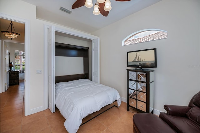 4308 Via Del Santi, Venice, FL 34293 - bedroom with light tile patterned floors and ceiling fan
