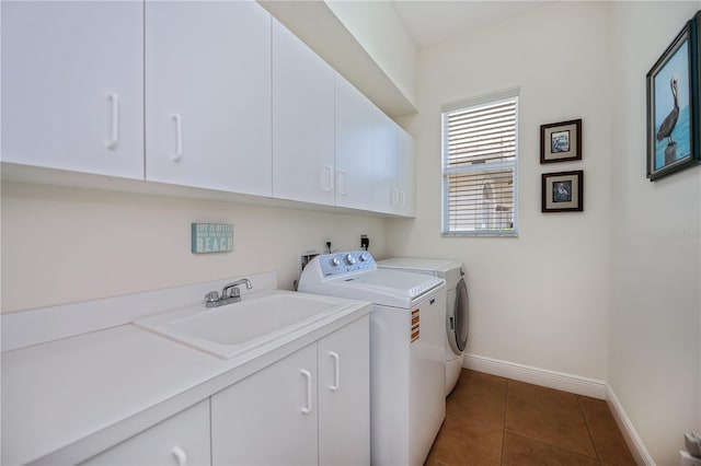 4308 Via Del Santi, Venice, FL 34293 - laundry room with cabinet space, washing machine and dryer, and dark tile patterned floors