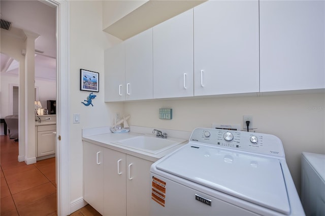 4308 Via Del Santi, Venice, FL 34293 - washroom featuring washer / clothes dryer, cabinet space, and light tile patterned floors