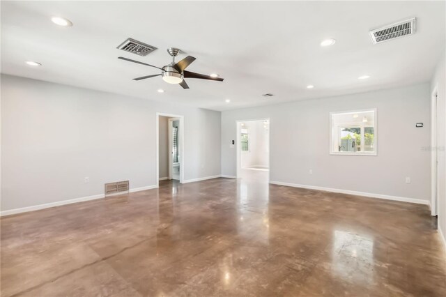 2555 Yucca Rd, Venice, FL 34293 - spare room with concrete floors, a ceiling fan, and recessed lighting