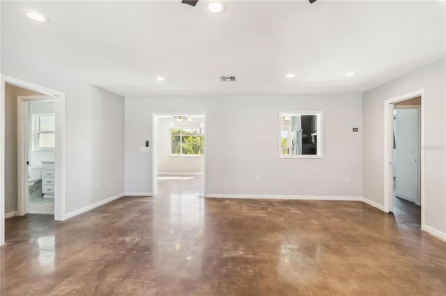2555 Yucca Rd, Venice, FL 34293 - unfurnished living room with finished concrete flooring and recessed lighting