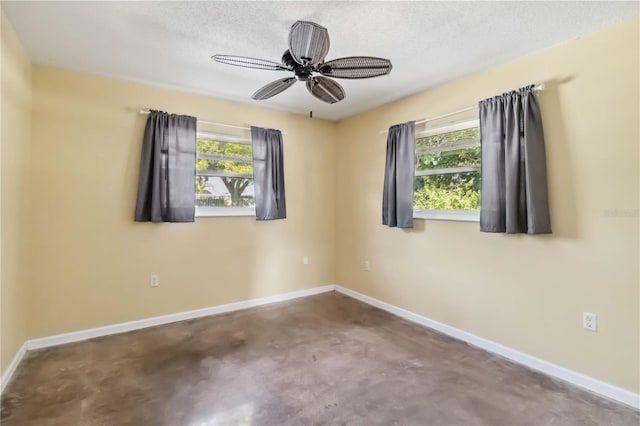 2555 Yucca Rd, Venice, FL 34293 - spare room featuring finished concrete floors, healthy amount of natural light, and ceiling fan