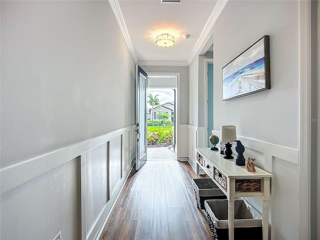 20749 Swallowtail Ct, Venice, FL 34293 - entryway featuring ornamental molding, wood finished floors, and wainscoting
