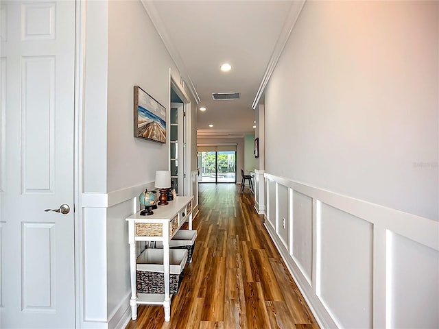 20749 Swallowtail Ct, Venice, FL 34293 - hallway with dark wood-style flooring, ornamental molding, wainscoting, and recessed lighting