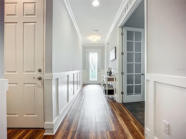 20749 Swallowtail Ct, Venice, FL 34293 - hallway with crown molding, dark wood-style floors, wainscoting, and a decorative wall