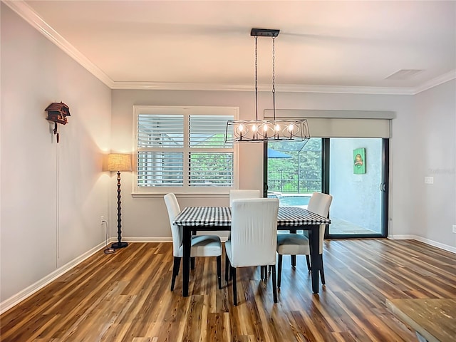 20749 Swallowtail Ct, Venice, FL 34293 - dining room featuring a chandelier, crown molding, and wood finished floors
