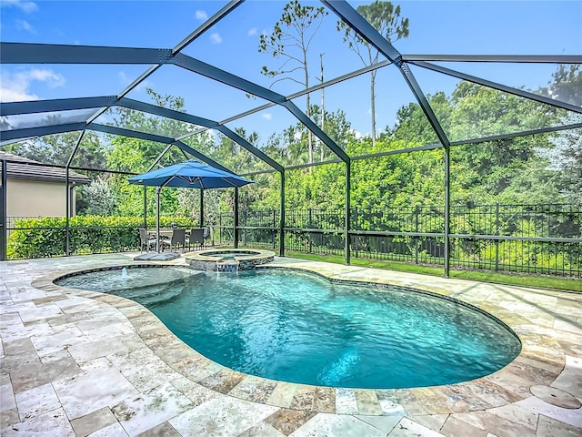 20749 Swallowtail Ct, Venice, FL 34293 - view of pool with a pool with connected hot tub, a patio, a fenced backyard, and glass enclosure