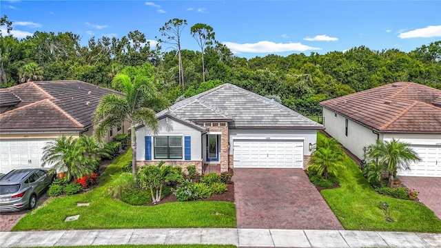 20749 Swallowtail Ct, Venice, FL 34293 - ranch-style house featuring stucco siding, stone siding, and a tiled roof