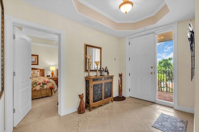 157 Tampa Ave E Unit 305, Venice, FL 34285 - entryway featuring light tile patterned floors, a tray ceiling, and ornamental molding