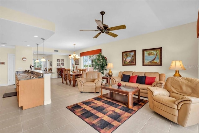 157 Tampa Ave E Unit 305, Venice, FL 34285 - living room with light tile patterned flooring, a ceiling fan, a chandelier, and recessed lighting