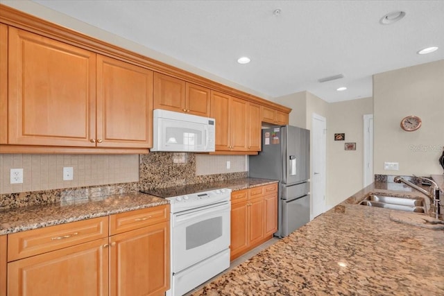 157 Tampa Ave E Unit 305, Venice, FL 34285 - kitchen featuring white appliances, light stone counters, tasteful backsplash, and recessed lighting