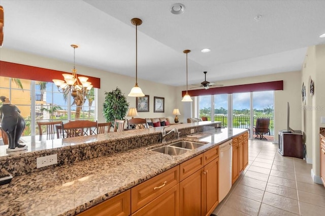 157 Tampa Ave E Unit 305, Venice, FL 34285 - kitchen featuring light stone counters, white dishwasher, hanging light fixtures, a chandelier, and light tile patterned floors