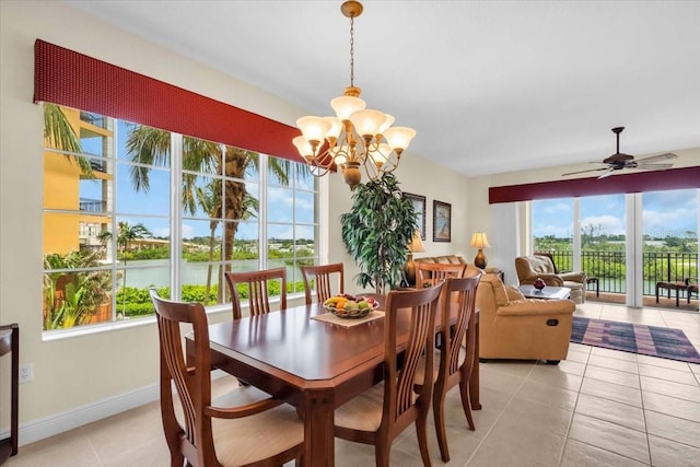 157 Tampa Ave E Unit 305, Venice, FL 34285 - dining room featuring plenty of natural light, a chandelier, light tile patterned floors, and ceiling fan