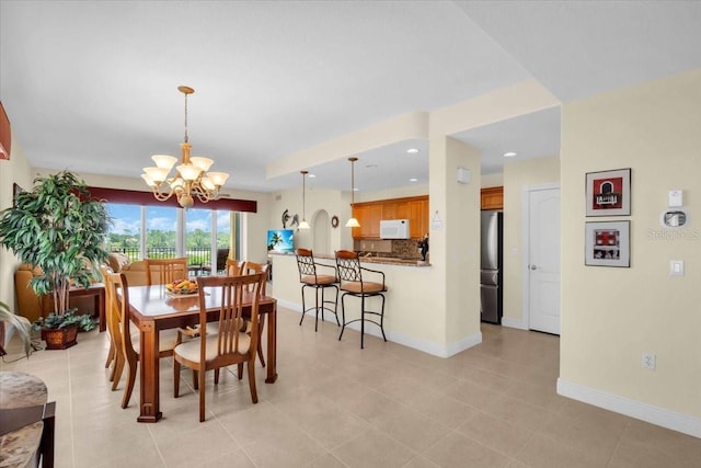 157 Tampa Ave E Unit 305, Venice, FL 34285 - dining area with a chandelier, light tile patterned floors, and recessed lighting
