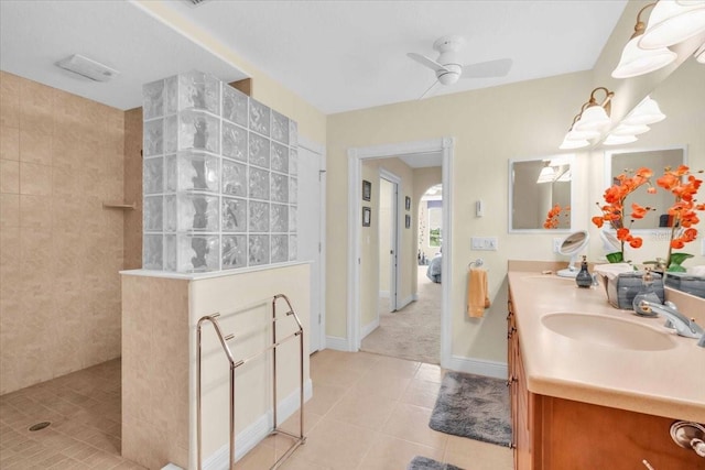 157 Tampa Ave E Unit 305, Venice, FL 34285 - bathroom featuring a walk in shower, double vanity, tile patterned floors, and a ceiling fan
