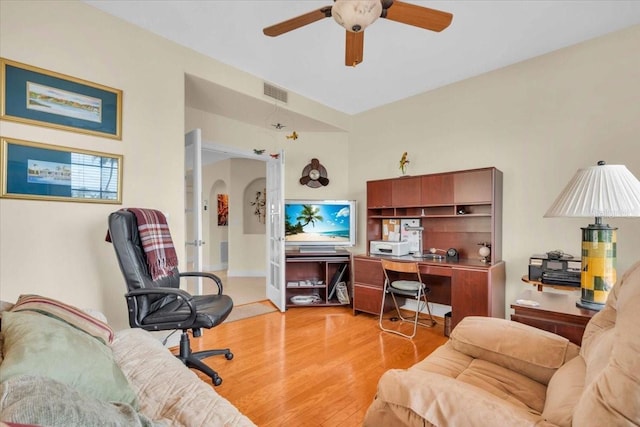 157 Tampa Ave E Unit 305, Venice, FL 34285 - office area featuring a ceiling fan, light wood-style flooring, and arched walkways