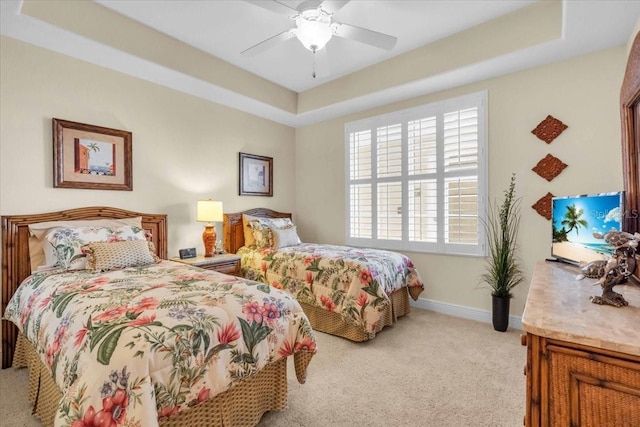 157 Tampa Ave E Unit 305, Venice, FL 34285 - bedroom featuring a tray ceiling, light colored carpet, and ceiling fan
