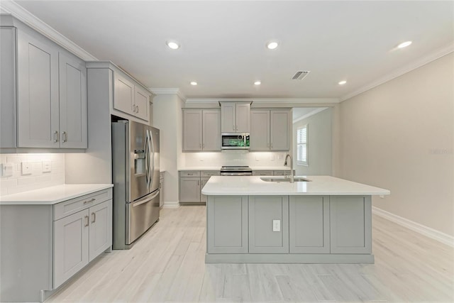 257 Teramo Way, Nokomis, FL 34275 - kitchen featuring appliances with stainless steel finishes, gray cabinets, crown molding, light countertops, and recessed lighting