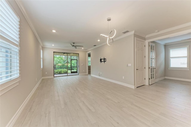 257 Teramo Way, Nokomis, FL 34275 - unfurnished room featuring a ceiling fan, ornamental molding, light wood-style floors, recessed lighting, and a chandelier