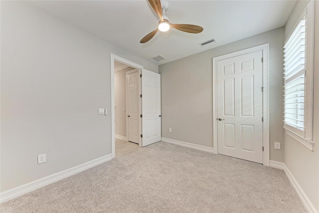 257 Teramo Way, Nokomis, FL 34275 - unfurnished bedroom featuring light colored carpet and a ceiling fan