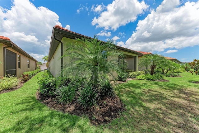 257 Teramo Way, Nokomis, FL 34275 - view of side of home featuring a yard and stucco siding