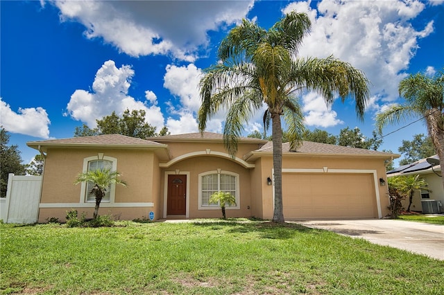 4150 Otoole St, North Port, FL 34291 - mediterranean / spanish home with stucco siding, an attached garage, and concrete driveway