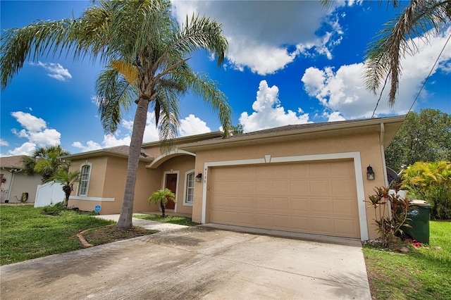 4150 Otoole St, North Port, FL 34291 - single story home with stucco siding, driveway, a garage, and a front lawn