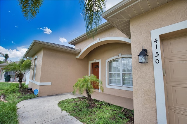 4150 Otoole St, North Port, FL 34291 - doorway to property with stucco siding