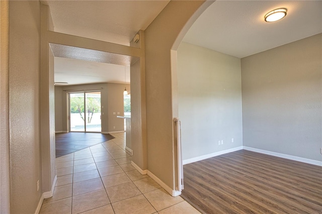 4150 Otoole St, North Port, FL 34291 - hall featuring arched walkways and light tile patterned floors