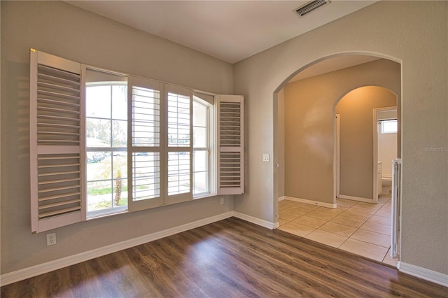 4150 Otoole St, North Port, FL 34291 - empty room featuring wood finished floors and arched walkways