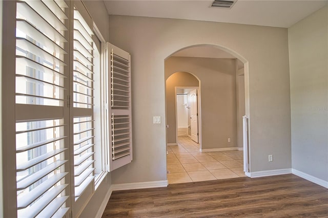 4150 Otoole St, North Port, FL 34291 - corridor with wood finished floors and arched walkways