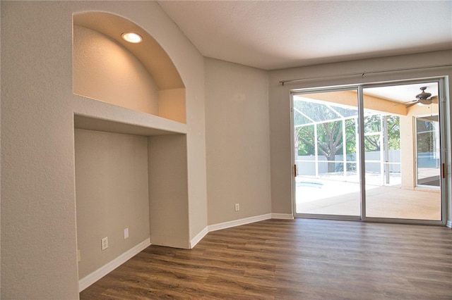 4150 Otoole St, North Port, FL 34291 - spare room featuring dark wood-style flooring, ceiling fan, and a textured wall