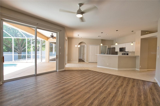 4150 Otoole St, North Port, FL 34291 - unfurnished living room with a ceiling fan and light wood finished floors