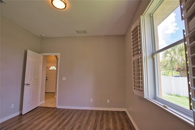 4150 Otoole St, North Port, FL 34291 - unfurnished room with dark wood-style flooring and arched walkways