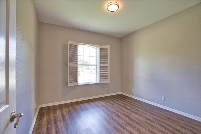 4150 Otoole St, North Port, FL 34291 - empty room with dark wood-style flooring and baseboards