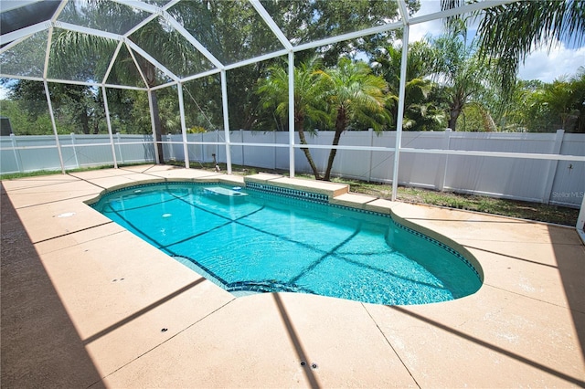 4150 Otoole St, North Port, FL 34291 - view of swimming pool with a patio, a fenced backyard, and glass enclosure