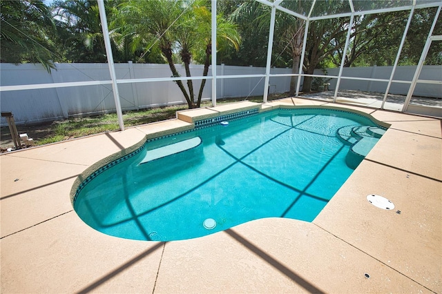 4150 Otoole St, North Port, FL 34291 - view of swimming pool with a fenced backyard, a patio, and glass enclosure