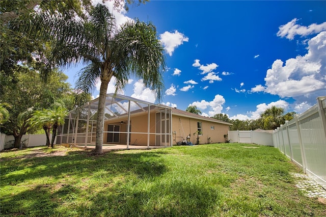 4150 Otoole St, North Port, FL 34291 - fenced backyard featuring a lanai and a patio area