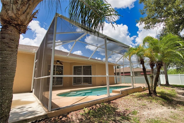 4150 Otoole St, North Port, FL 34291 - view of swimming pool featuring a ceiling fan, a patio, and a lanai