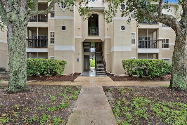 5134 Northridge Rd Unit 303, Sarasota, FL 34238 - view of apartment building / complex featuring stairway