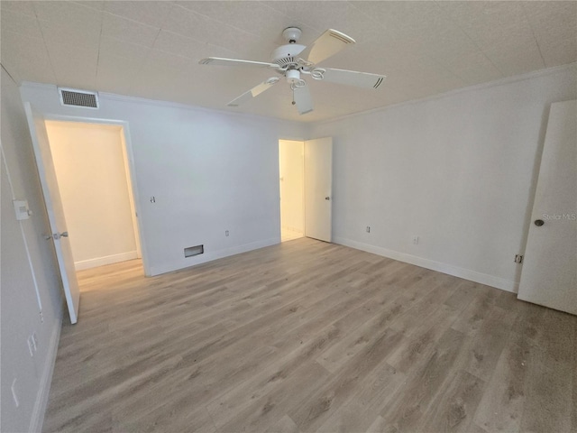 624 White Pine Tree Rd Unit 5, Venice, FL 34285 - spare room featuring wood finished floors, ceiling fan, and ornamental molding