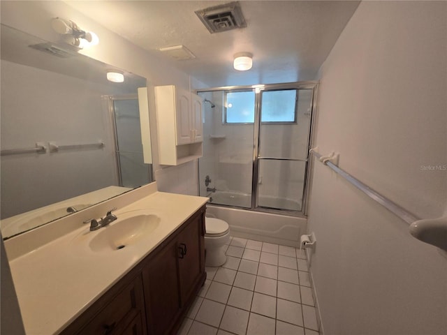 624 White Pine Tree Rd Unit 5, Venice, FL 34285 - full bath featuring tile patterned floors, vanity, and enclosed tub / shower combo